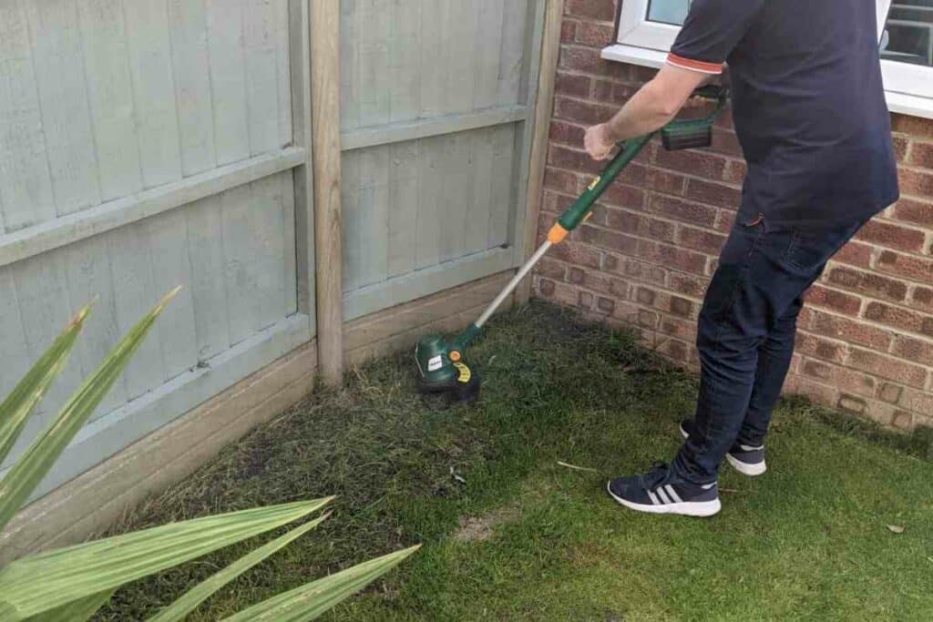 using a grass strimmer