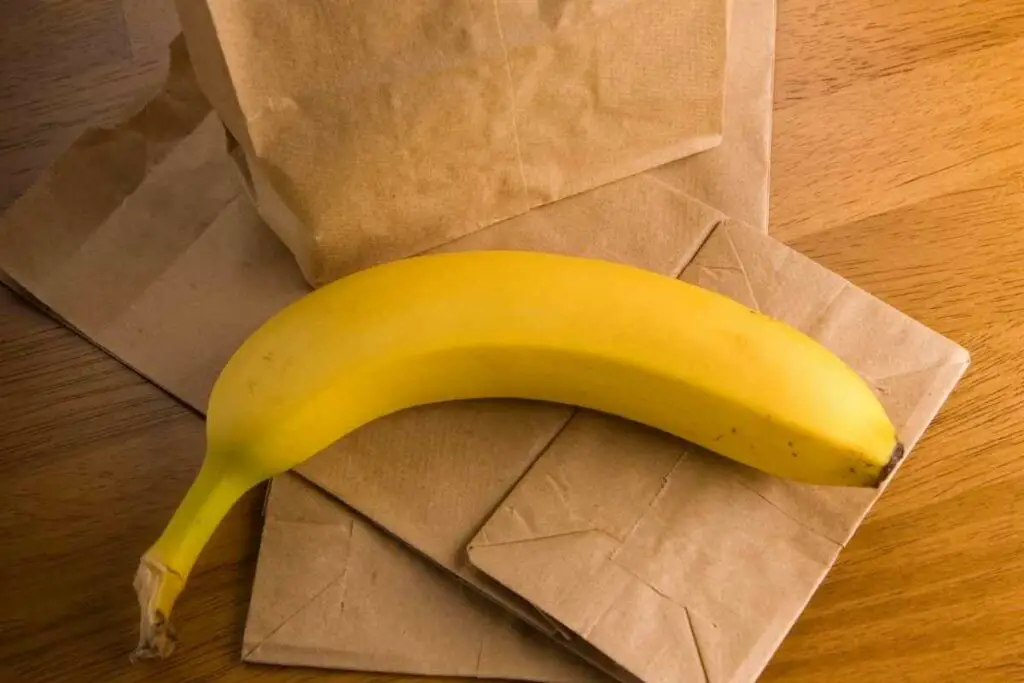 Organic banana on brown bag