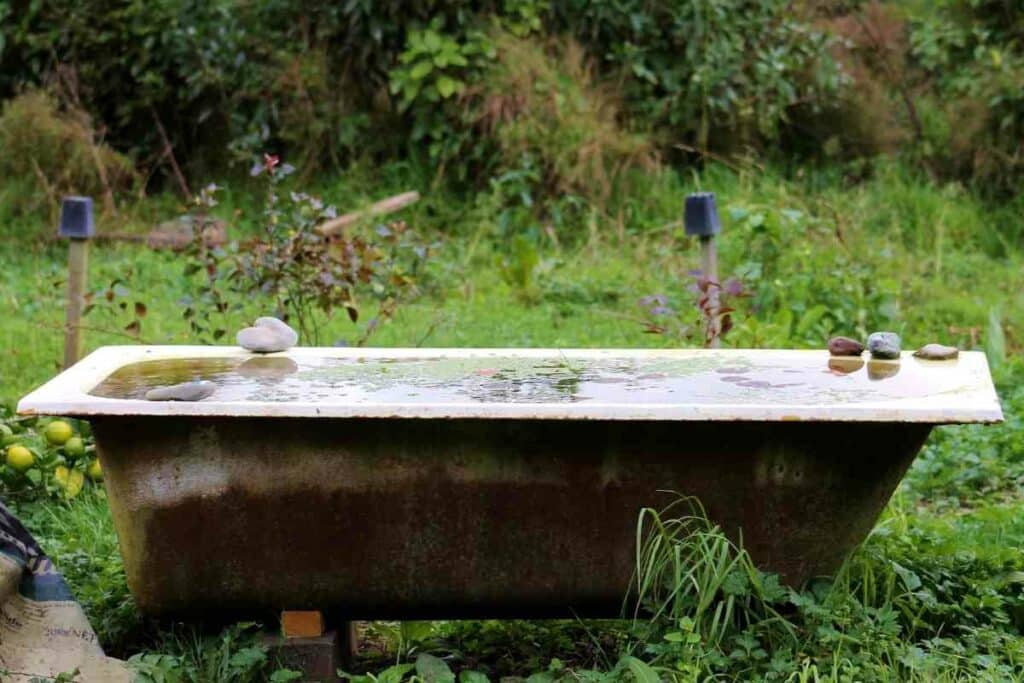 Countryside outdoor bathtub full of water