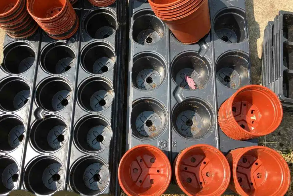 Recyclable plastic pots in garden