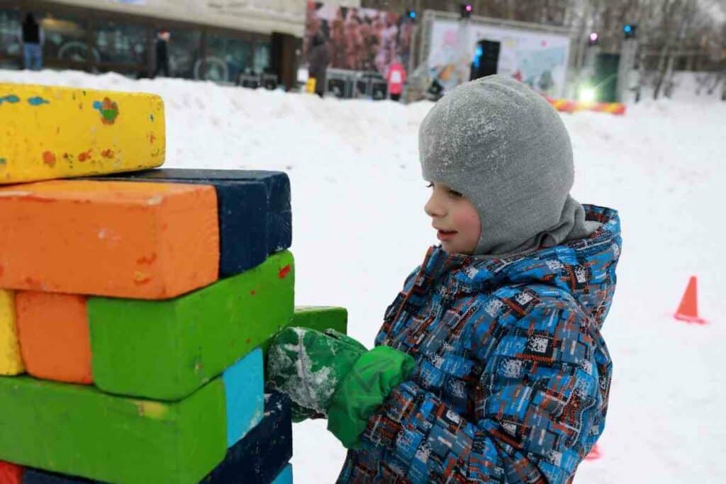 Backyard Jenga kids in winter