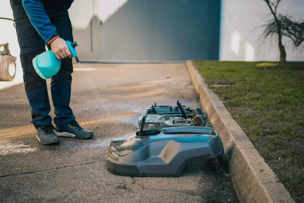 robotic mower being cleaned