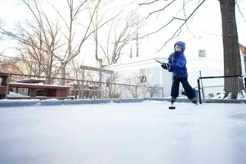 Child enjoys Backyard ice rink