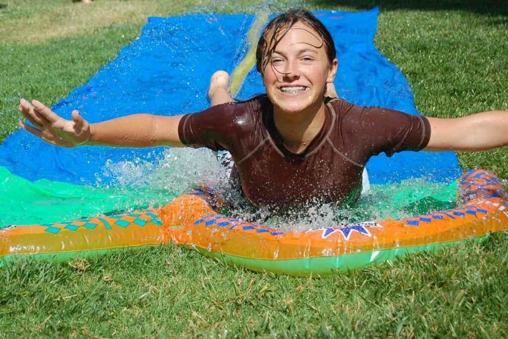 Girl Having fun with Slip n slide 