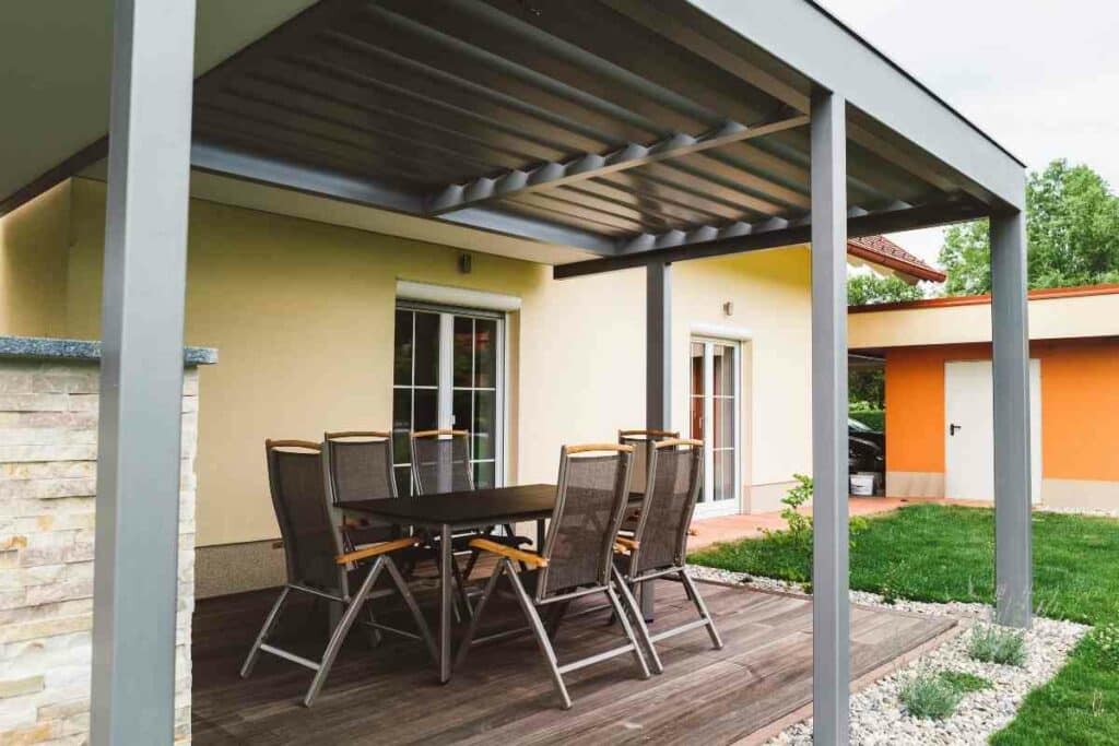 Hanging string lights on aluminum pergola guide