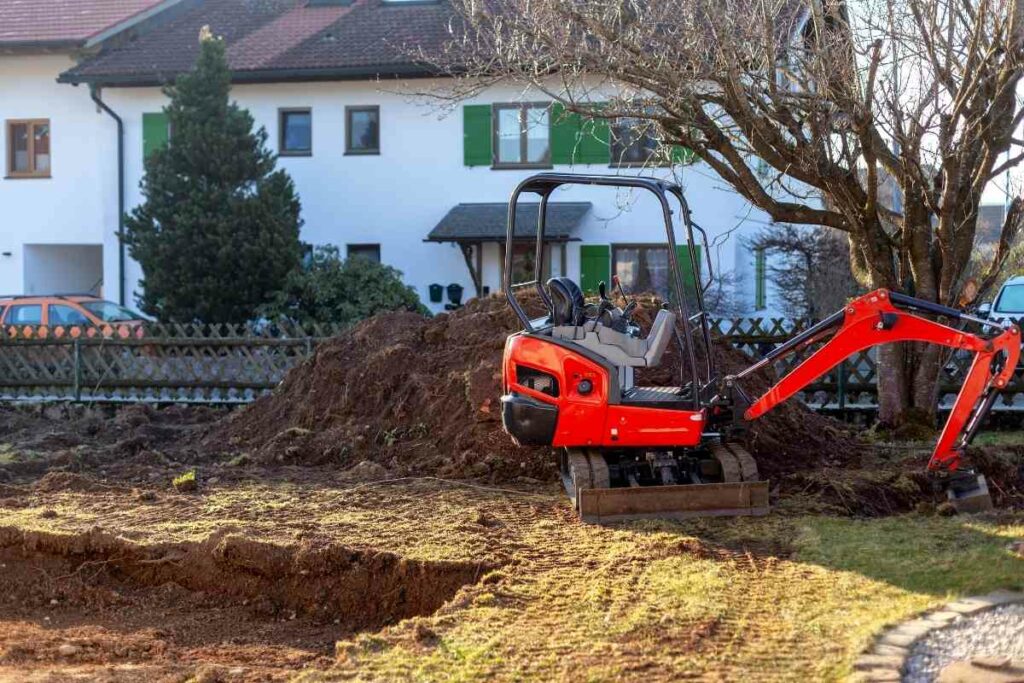 Mini excavator digging a hole