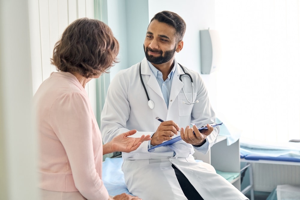 A woman talking with her doctor.