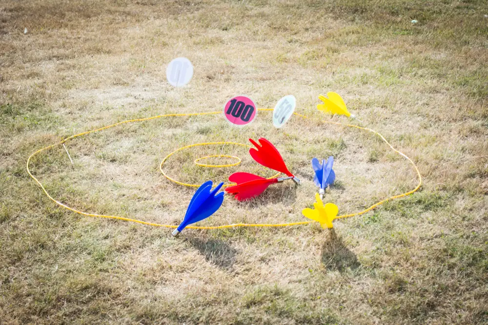 A game of lawn darts on the lawn.