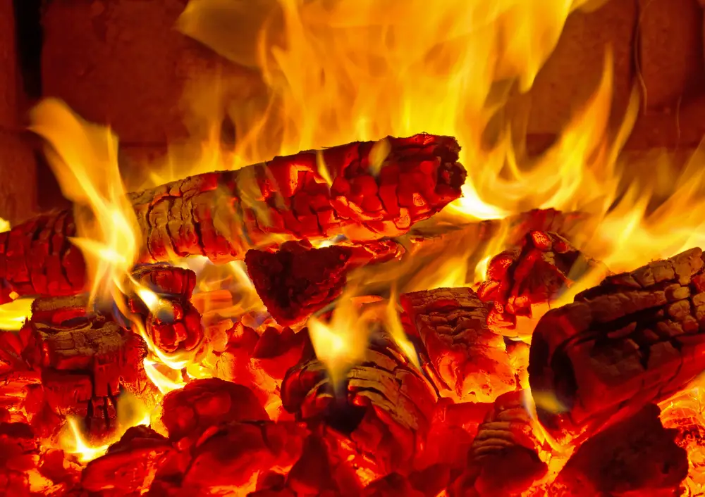 A closeup of wood burning in a fire.