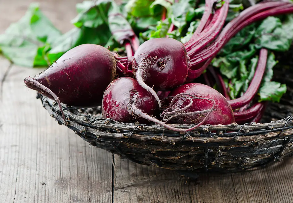 Beets in wooden bowl.