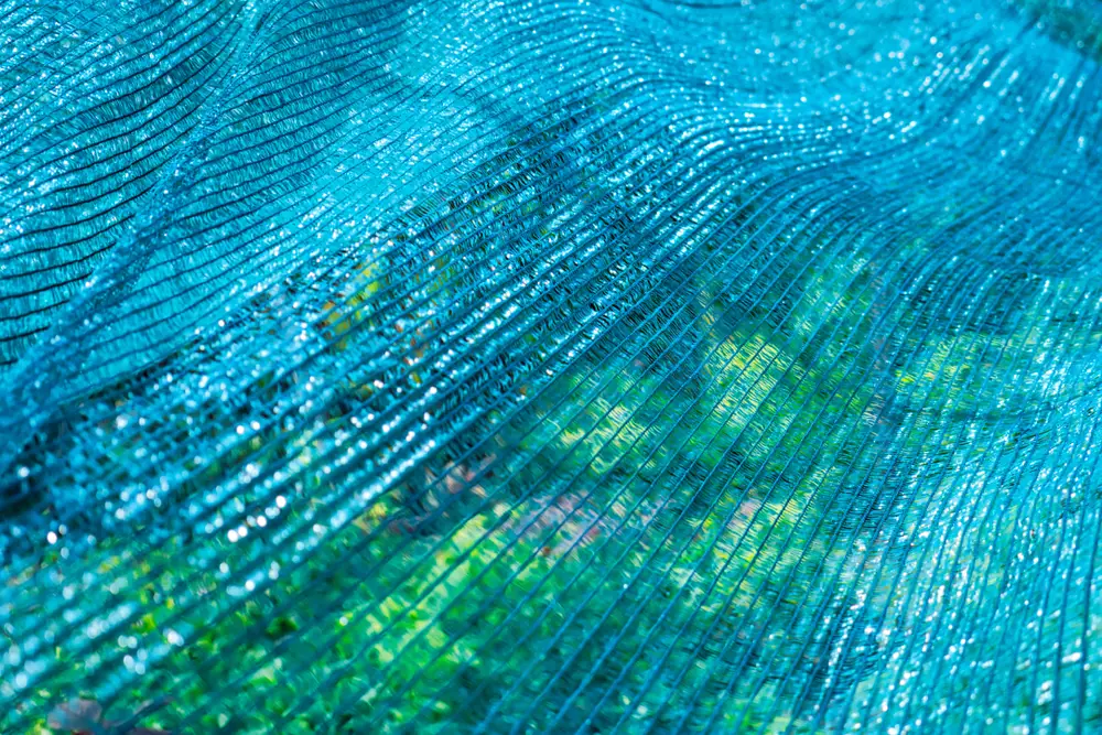 A closeup of blue shade cloth.